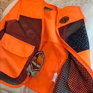 Camo shirt and orange hunting vest